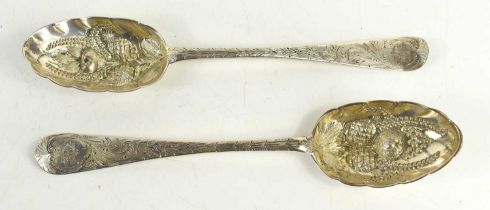 A pair of Georgian silver berry spoons, embossed with decoration, and engraved to the handle, 5.