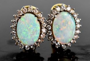 A pair of 18ct gold, opal and diamond earrings, the oval opals of approximately 14 by 9.9 by 2.