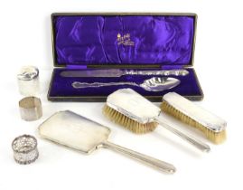 A silver backed dressing table set together with two silver napkin rings, silver plated cake knife