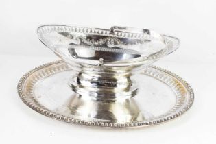 A silver plated oval pedestal basket with pierced rim and decoration and bright cut engraving and