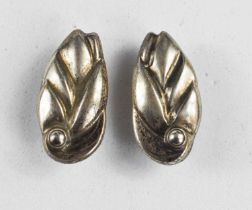 A pair of Georg Jensen silver earrings, Danish, in the form of stylised leaves, stud backs.