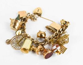 A 9ct gold charm bracelet, with fourteen charms of various form including seal, lion, cauldron, wine