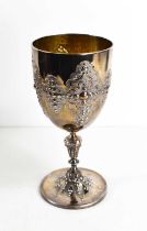 A silver chalice, with gilded interior, and embossed with vacant cartouches, with knop stem,