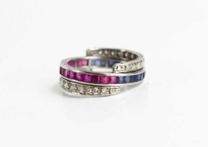 A diamond, sapphire and ruby tricolour ring with hinged half bands of sapphires and rubies with