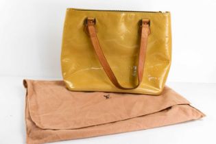 A Louis Vuitton gold coloured patent leather handbag, 31cm.