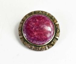 A Ruskin pottery and silver brooch, the pink plaque set in a decorative silver border, 3cm