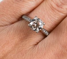 A solitaire diamond and 950 platinum ring, the brilliant cut solitaire of approximately just over