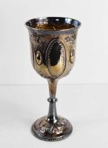 A Victorian silver chalice, with gilded interior, and embossed with decoration, Sheffield 1877, 4.