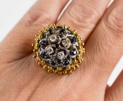 A gold, diamond and sapphire cluster ring, unmarked but testing as 18ct gold, the four brilliant cut