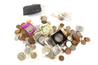 A selection of commemorative coins, together with a purse containing GB Victorian coins and other