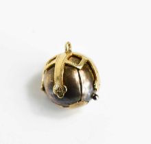 A 9ct gold and silver Masonic orb, the reticulated sphere opening to form a six part cross,