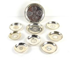 A collection of Indian silver and white metal dishes, the dishes set with various Indian silver