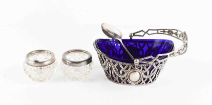 A French silver bon bon basket with blue liner, marked 800, the pierced body decorated with oval