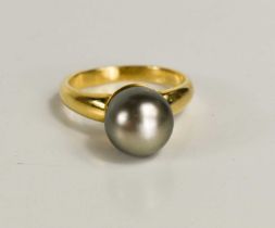 An 18ct gold and pearl dress ring, the grey pearl of approximately 9.4mm, size L, 4.75g.