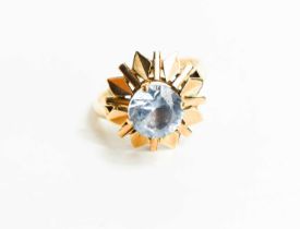 A 9ct gold and aquamarine modernist ring, the raised claw set aquamarine of approximately 9mm