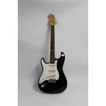 Fender Stratocaster left handed re issue from 1988/89, model number H034064 in black and white.