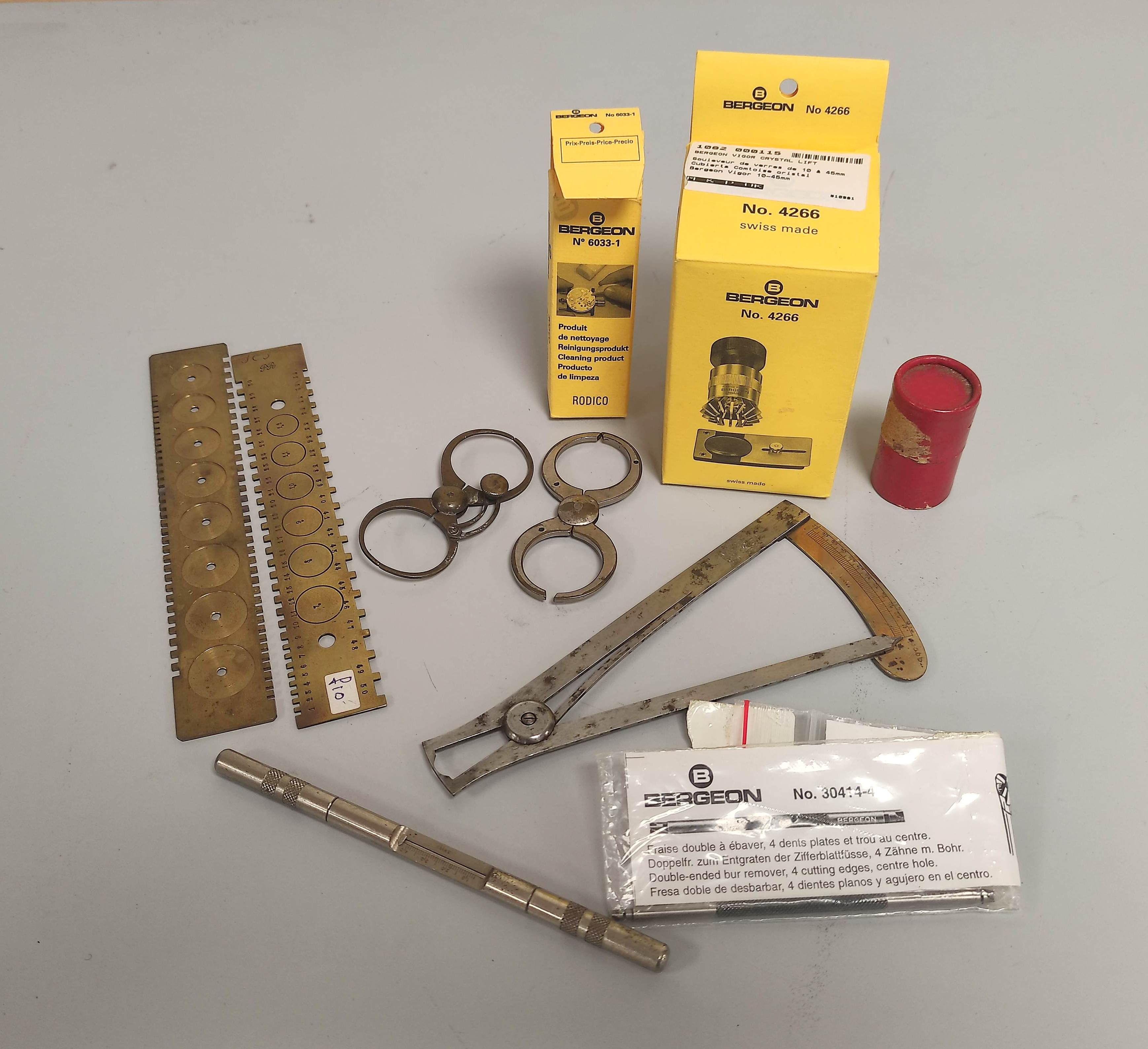 Watchmakers tools collection of tools include two brass mainspring gauges, two balance truing