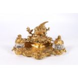 French gilt bronze deskstand, the stamp box with cover modelled as a bird, the glass inkwell