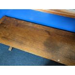 An oak refectory table with egg and dart detail to the apron on cup and cover supports and trestle