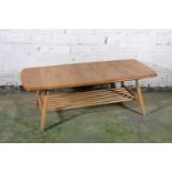 Ercol blonde tone model 398 two-tier coffee table, 105cm long.