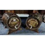 Pair of coopered oak bar top casks advertising Gonzalez Byass sherry, each with white metal spigot