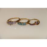 9k gold dress ring with 7 light purple marquise cut stones, size R, 9k dress ring with three blue