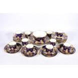 19th century English porcelain thirty-six piece tea set, the cobalt blue ground decorated with