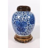 Early 19th century Chinese blue and white ginger jar with floral design, with pierced hardwood cover