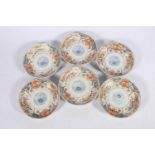 Set of six Japanese Imari decorated dishes with floral decoration, 16cm diameter.