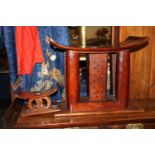 20th century carved and pierced Eastern hardwood stool in the form of a neck rest, 43cm tall and a