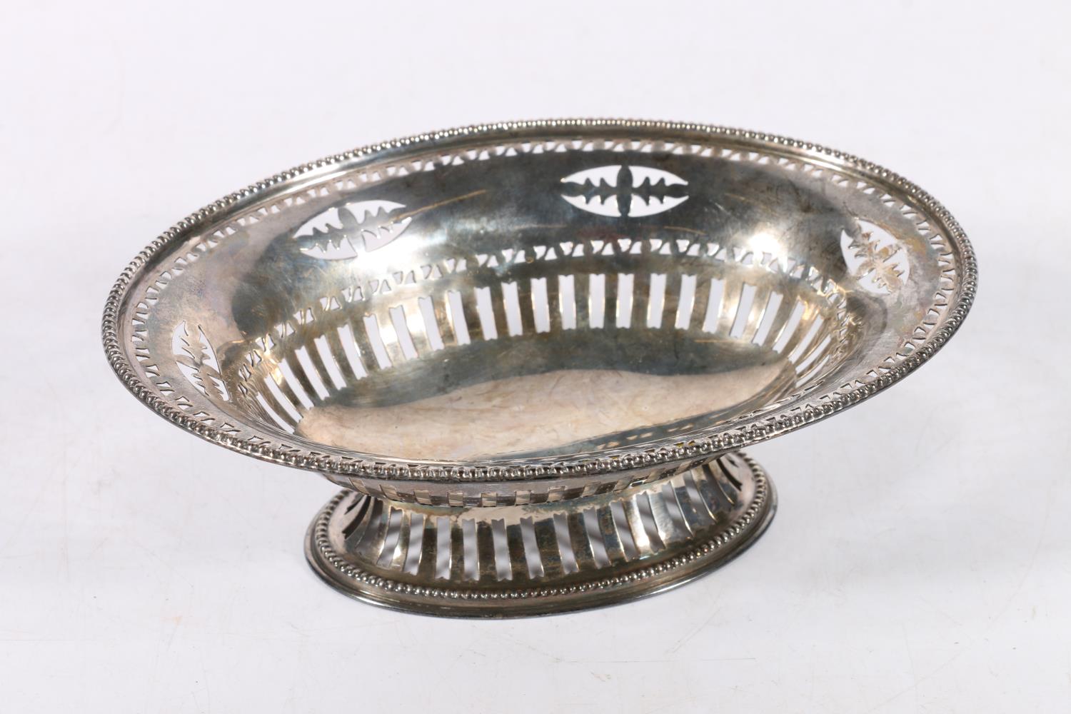 George V silver pedestal bon bon dish of oval shape with pierced bands by Cooper Brothers & Sons