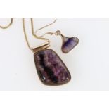 9ct gold mounted cabochon amethyst pendant on 9ct gold chain and a matching earring, 19g.