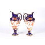 Pair of Victorian Royal Crown Derby ewer jugs decorated in the Imari palate, date marks for 1899,