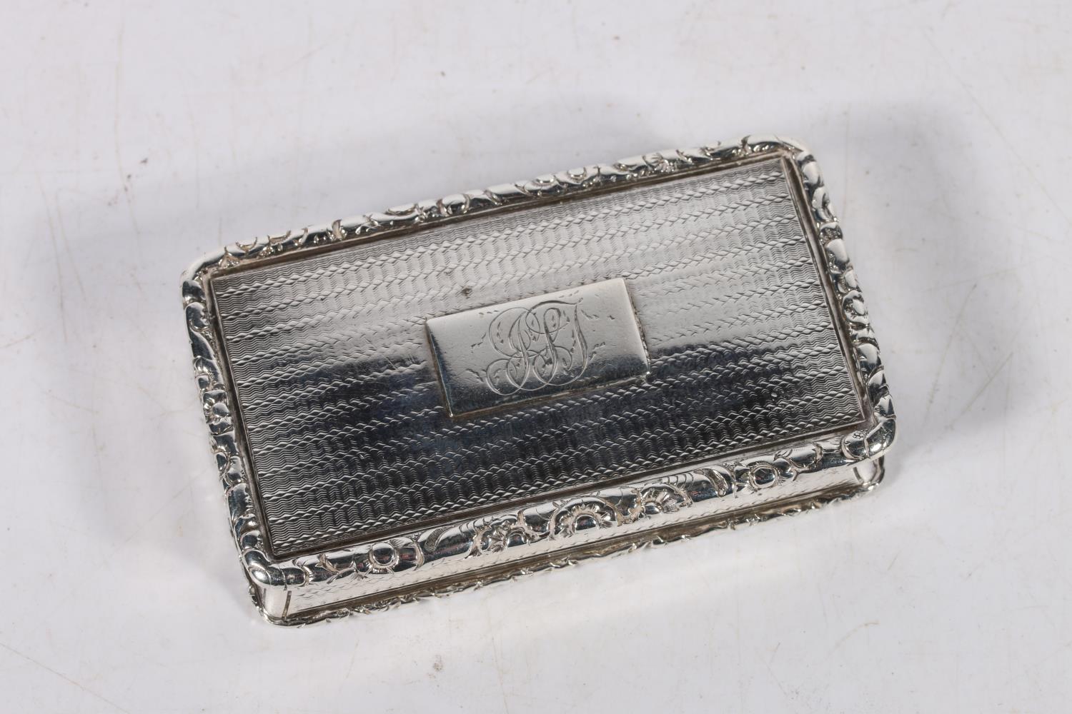 Early 19th century silver snuff box with engine turned decoration and floral rim by Nathaniel Mills,