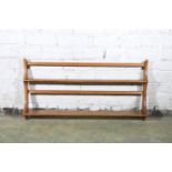 Ercol blonde tone two-tier wall mountable plate rack, 96cm long.