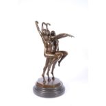 20th century cast bronze sculpture of three nude synchronised swimmers, raised on a stepped circular