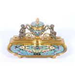French gilt bronze deskstand modelled with an urn having cherub sat upon scroll supporters, the