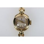 Ladies 18ct gold cased wristwatch with 17 jewel Omega movement #26593901, on 18ct gold bracelet,