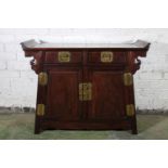 Chinese hardwood side cabinet in the form of an altar cabinet with two frieze drawers above tow