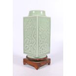 Chinese celadon porcelain vase of square section, decorated with relief floral designs, reign seal