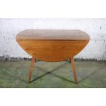 Ercol model 383 drop leaf oval dining table, 112cm wide.