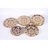 Nine Royal Crown Derby bone china 1128 Imari pattern side plates, date marks from 1974-2005, 22cm