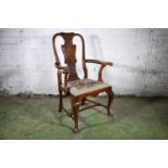 18th century walnut carver armchair having shaped top rail, splat with scroll motifs, out swept