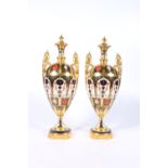 Pair of Royal Crown Derby bone china 1128 pattern Imari palate urns, date marks for 1973, 31cm tall.
