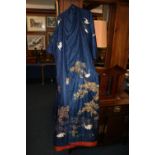Japanese silk kimono gown, decorated with bullion thread depicting red-headed cranes in a landscape,