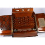 Victorian mahogany slope-fronted stationary box, the top with day-date-month calendar, two doors