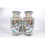 Pair of 20th century Chinese pottery vases of hexagonal baluster shape decorated with kylin dragon