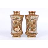 Pair of Japanese Satsuma pottery vases of flaring hexagonal shape decorated with figures and gods in