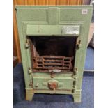 Green finished cast metal stove 'Vesper?', 72cm tall.