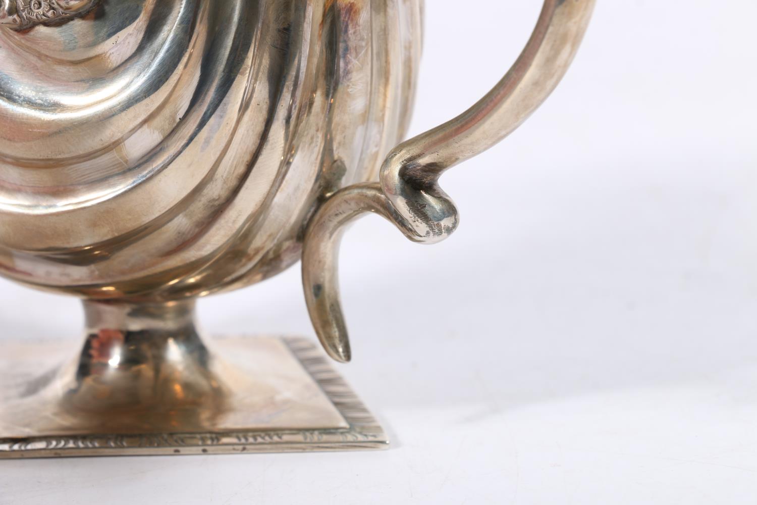 Edwardian silver cream jug with flower and scroll border and serpent handle raised on diamond shaped - Image 4 of 5